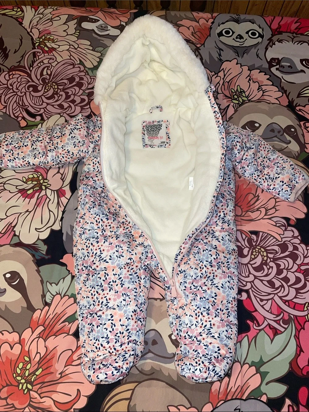 Multi color floral Kensie girl footed snowsuit (3/6mos)